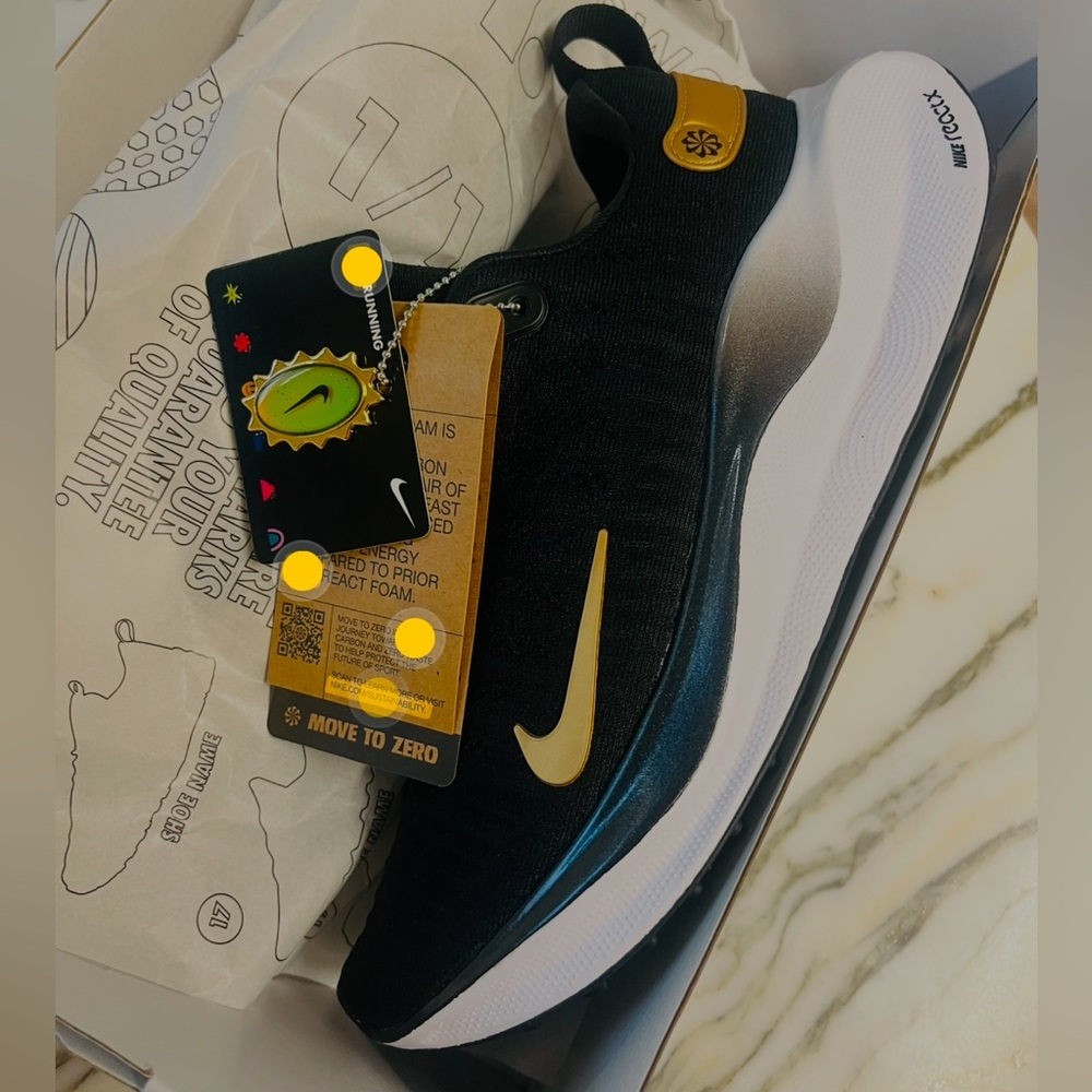 SOLD! Nike Reactx women size 9 Black/gold with custom Equinox branding. new